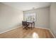 Simple bedroom with hardwood floors, a writing desk, and a window with blinds at 1801 E Lake Rd # 15C, Palm Harbor, FL 34685