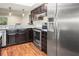 Kitchen boasts stainless steel appliances and granite countertops at 1801 E Lake Rd # 15C, Palm Harbor, FL 34685