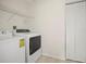 Laundry room with washer, dryer, shelving and additional storage at 1801 E Lake Rd # 15C, Palm Harbor, FL 34685