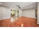 Spacious living room with hardwood floors and access to a patio at 1801 E Lake Rd # 15C, Palm Harbor, FL 34685