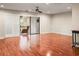 Hardwood floor living room with sliding doors to a patio at 1801 E Lake Rd # 15C, Palm Harbor, FL 34685