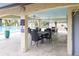 Community pool area with covered seating and tables at 1801 E Lake Rd # 15C, Palm Harbor, FL 34685