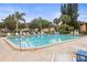 Inviting community pool with lounge chairs and patio area at 1801 E Lake Rd # 15C, Palm Harbor, FL 34685