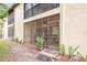 View of the private screened porch from the backyard at 1801 E Lake Rd # 15C, Palm Harbor, FL 34685