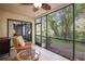 Screened porch overlooking a wooded area at 1801 E Lake Rd # 15C, Palm Harbor, FL 34685