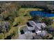 Aerial view of house, pool, and surrounding property at 18419 Tyler Rd, Odessa, FL 33556