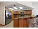 Kitchen with granite countertops and wooden cabinets at 18419 Tyler Rd, Odessa, FL 33556