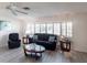 Living room with gray floors, comfy seating, and lots of natural light at 18719 Van Nuys Cir, Port Charlotte, FL 33948