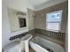 Bathroom with tub, sink, and tile at 2126 43Rd N Ave, St Petersburg, FL 33714