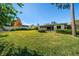 Large backyard with lush green grass at 2389 Sarazen Dr, Dunedin, FL 34698