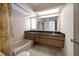 Bathroom with tiled shower, granite countertop vanity at 2389 Sarazen Dr, Dunedin, FL 34698