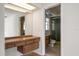 Clean bathroom with wood vanity and shower/tub combo at 2389 Sarazen Dr, Dunedin, FL 34698