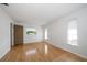 Simple bedroom with wood floors and lots of natural light at 2389 Sarazen Dr, Dunedin, FL 34698