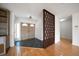 Bright entryway with wood floors and a room divider at 2389 Sarazen Dr, Dunedin, FL 34698