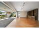 Living area featuring hardwood floors and built-in shelving at 2389 Sarazen Dr, Dunedin, FL 34698