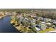 Neighborhood view with lake and homes at 26853 Winged Elm Dr, Wesley Chapel, FL 33544