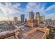 Aerial perspective showcasing a cityscape with high-rises, parking structures, and surrounding urban development at 301 1St S St # 1404, St Petersburg, FL 33701