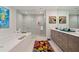 Modern bathroom with double vanity, large shower, and bathtub at 301 1St S St # 1404, St Petersburg, FL 33701