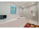 Spa-like bathroom with soaking tub, glass shower, and colorful rug at 301 1St S St # 1404, St Petersburg, FL 33701