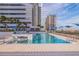 Relaxing pool with surrounding lounge chairs and modern design at 301 1St S St # 1404, St Petersburg, FL 33701