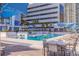 Resort-style pool with plenty of lounge chairs and umbrellas at 301 1St S St # 1404, St Petersburg, FL 33701