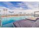 Luxury rooftop pool with spacious lounge chairs and stunning water views at 301 1St S St # 1404, St Petersburg, FL 33701