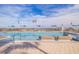 Expansive rooftop pool with city and water views; lounge chairs and umbrellas at 301 1St S St # 1404, St Petersburg, FL 33701