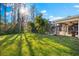 Large backyard with lush green grass at 3312 Cobbs Ct, Palm Harbor, FL 34684