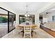 Bright dining area with sliding glass doors leading to the pool at 3312 Cobbs Ct, Palm Harbor, FL 34684