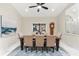 Elegant dining room featuring a large table, neutral decor, and natural light at 3312 Cobbs Ct, Palm Harbor, FL 34684