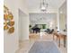 Elegant entryway with high ceilings, a console table, and a view into the living room at 3312 Cobbs Ct, Palm Harbor, FL 34684