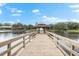 Wooden gazebo on a pier over a lake at 3312 Cobbs Ct, Palm Harbor, FL 34684