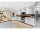 Modern kitchen with stainless steel appliances and granite countertops at 3312 Cobbs Ct, Palm Harbor, FL 34684