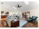 Living room with hardwood floors, kitchen access and view of pool at 3312 Cobbs Ct, Palm Harbor, FL 34684