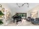 Music room featuring a grand piano, comfy armchairs and sliding doors leading to the pool at 3312 Cobbs Ct, Palm Harbor, FL 34684