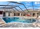 Stunning screened pool and spa under a bright sky at 3312 Cobbs Ct, Palm Harbor, FL 34684