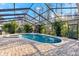 Refreshing screened pool and spa area at 3312 Cobbs Ct, Palm Harbor, FL 34684