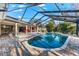 Relaxing screened pool and spa with patio furniture at 3312 Cobbs Ct, Palm Harbor, FL 34684