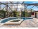 Enjoy the screened pool and spa at 3312 Cobbs Ct, Palm Harbor, FL 34684