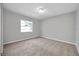 Well-lit bedroom featuring neutral walls and carpeted floors at 3917 Briarlake Dr, Valrico, FL 33596