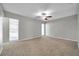 Large bedroom with neutral walls and plush carpeting at 3917 Briarlake Dr, Valrico, FL 33596