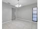 Bright dining room with tile floors and a modern chandelier at 3917 Briarlake Dr, Valrico, FL 33596