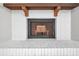 White brick fireplace with a wooden mantel at 3917 Briarlake Dr, Valrico, FL 33596