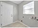 Laundry room with washer/dryer hookups and exterior access at 3917 Briarlake Dr, Valrico, FL 33596