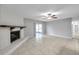 Living room with fireplace, tile floor and access to patio at 3917 Briarlake Dr, Valrico, FL 33596