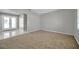 Living room with carpeted floor and view of the entryway at 3917 Briarlake Dr, Valrico, FL 33596