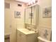 Bright bathroom with double vanity and medicine cabinet at 400 Glennes Ln # 108, Dunedin, FL 34698