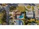 Aerial view of a single-Gathering home featuring a private pool and well-manicured backyard at 4001 Harbor Hills Dr, Largo, FL 33770