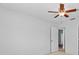 Bright room with white walls, a ceiling fan, and a view of the hallway at 4001 Harbor Hills Dr, Largo, FL 33770