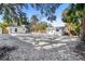 Spacious backyard, gravel surface, and shed at 4020 S West Shore Blvd, Tampa, FL 33611